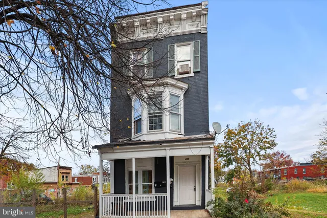 front view of a building with a trees