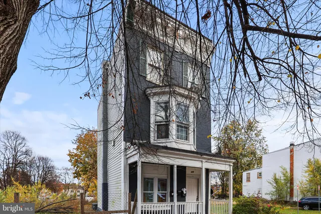 a view of a building with a yard