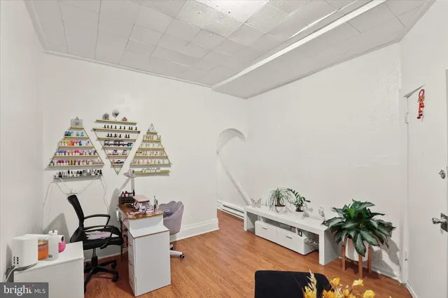 a view of a workspace with furniture and a potted plant
