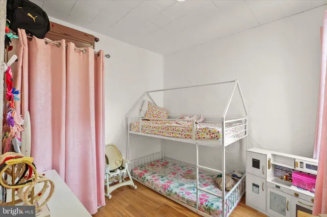 a bed room with a bed and a window