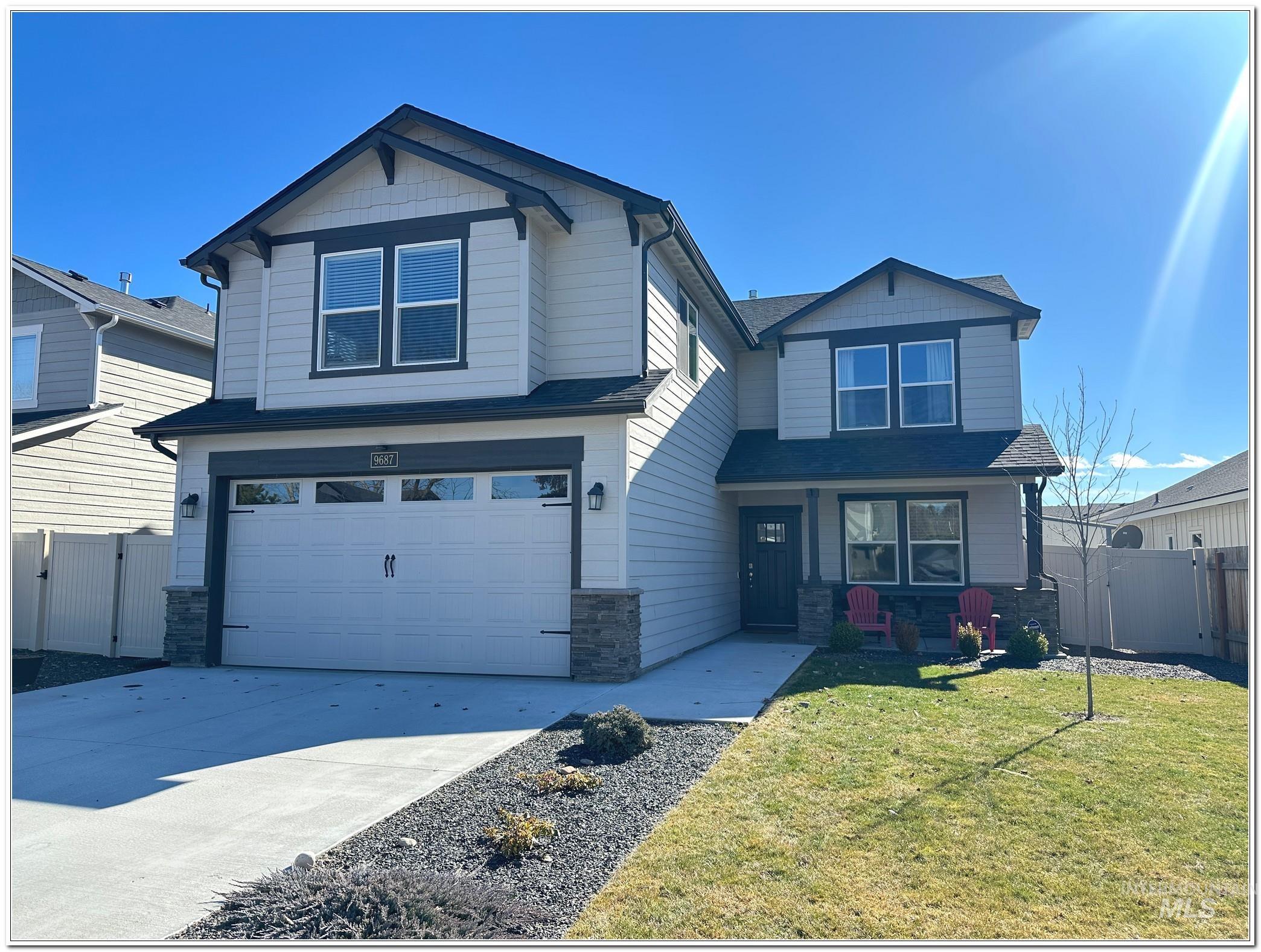 9687 West Arnold Road Boise, ID 83714 - Photo 1 of 49 Craftsman-style home featuring a gate, stone siding, an attached garage, and concrete driveway