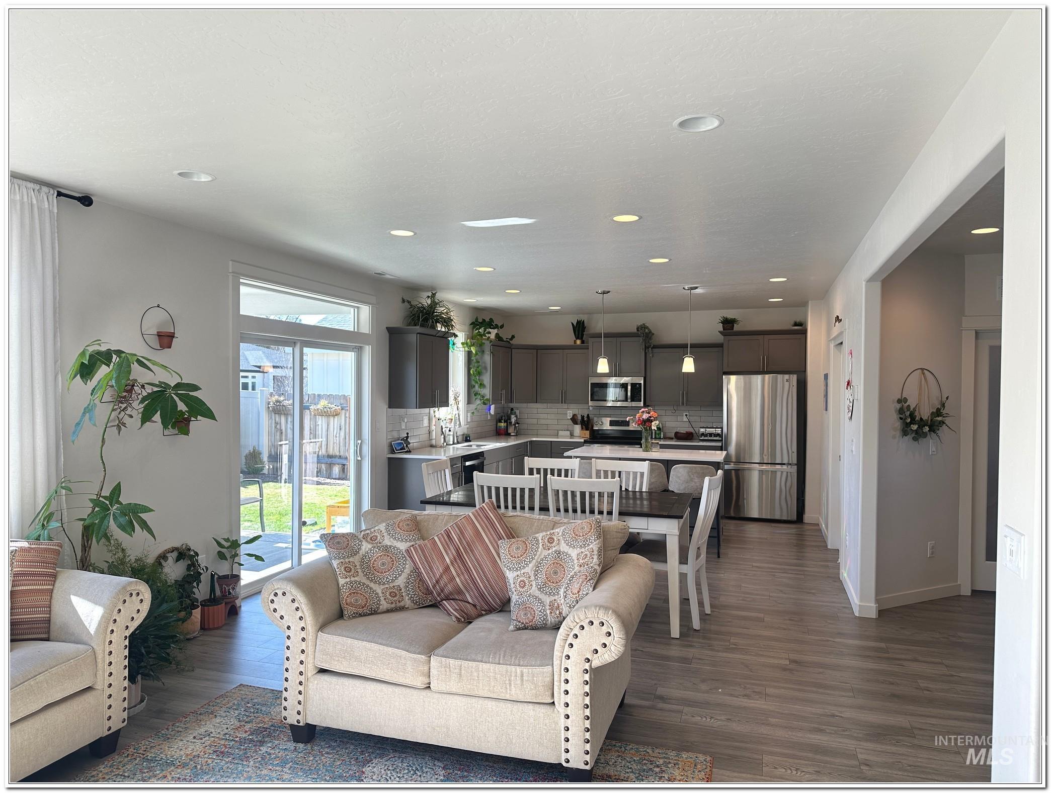 9687 West Arnold Road Boise, ID 83714 - Photo 13 of 49 Living room with dark wood-style flooring and recessed lighting