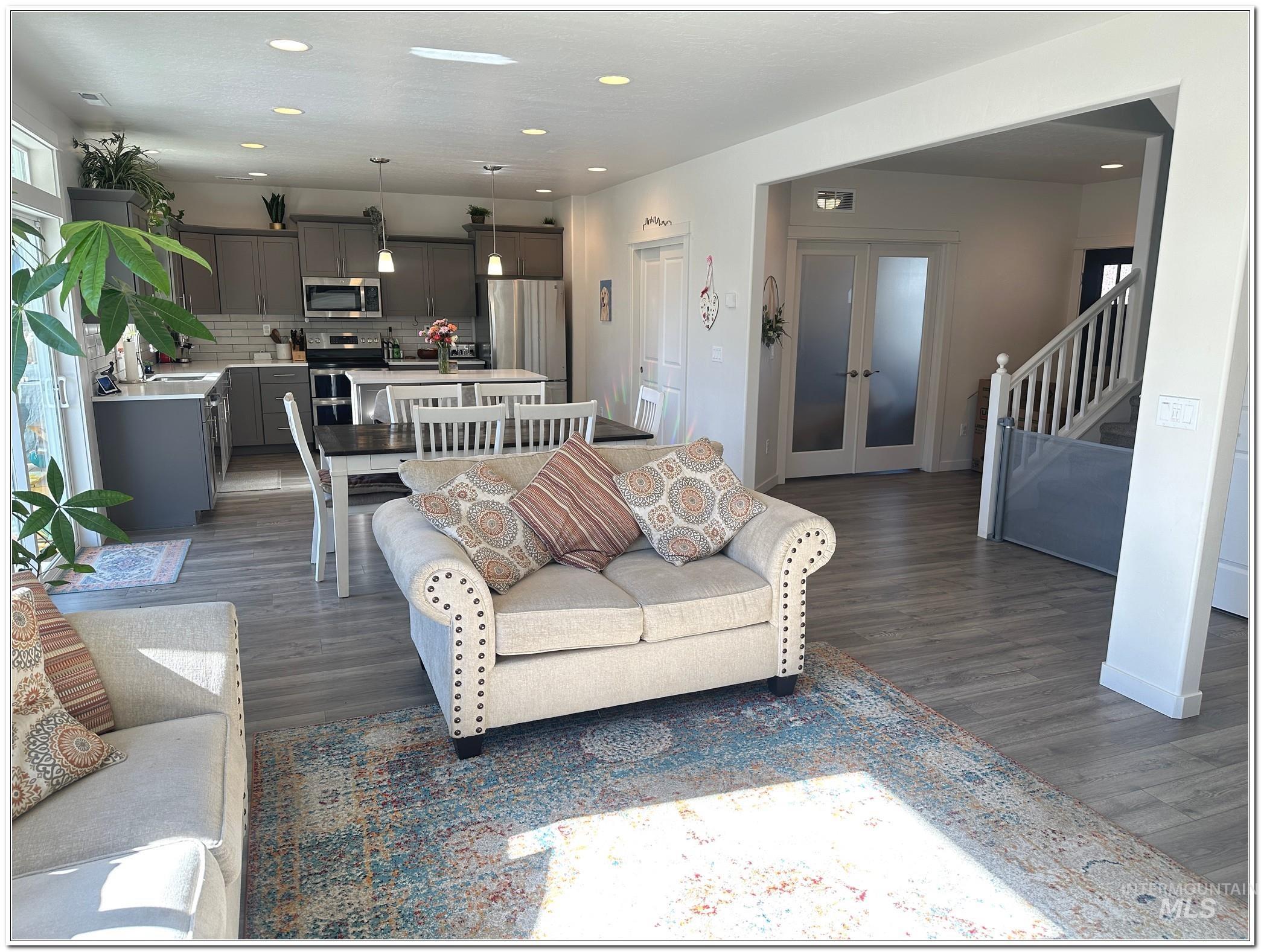 9687 West Arnold Road Boise, ID 83714 - Photo 14 of 49 Living area with recessed lighting, dark wood-type flooring, and french doors