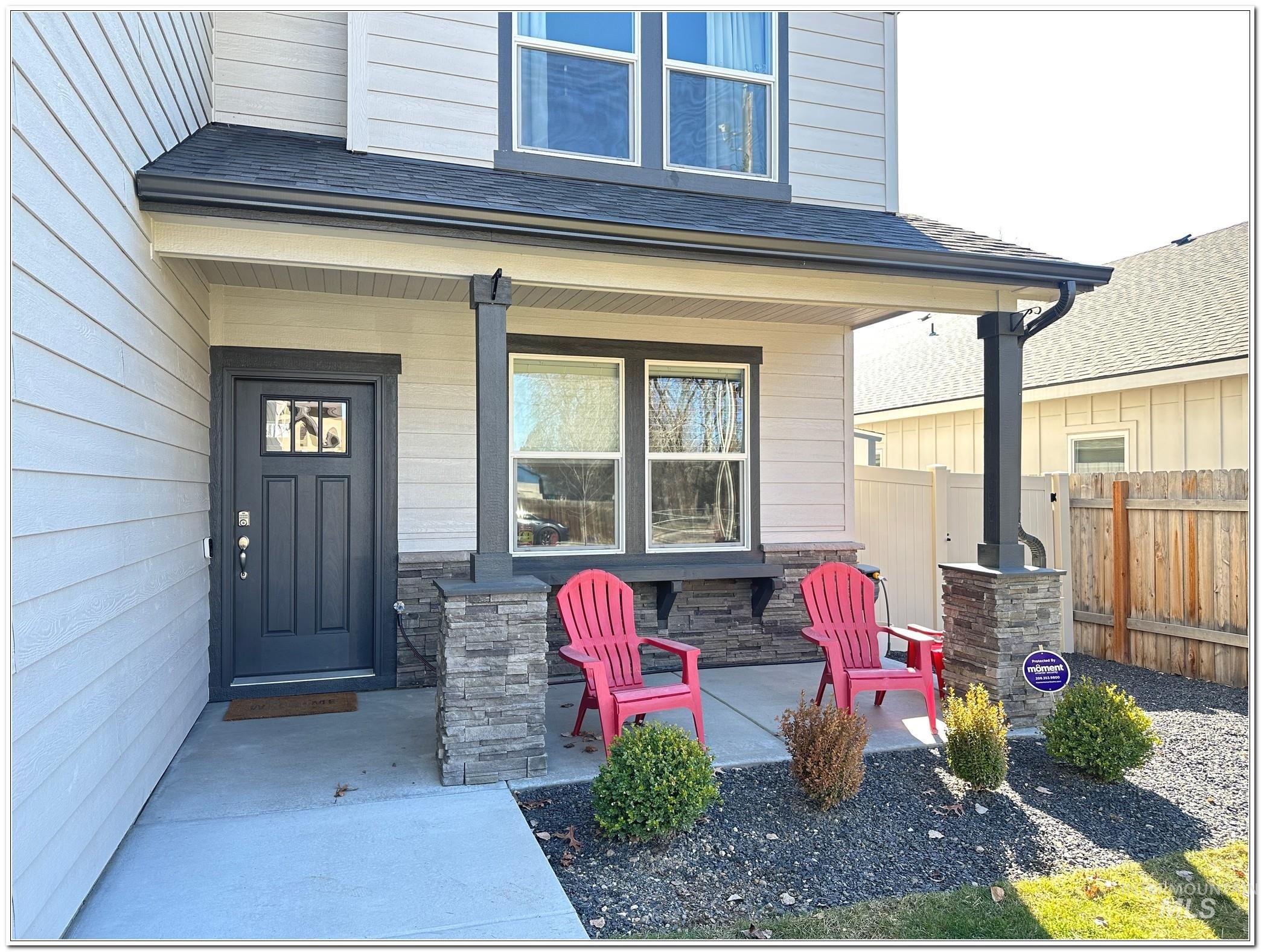 9687 West Arnold Road Boise, ID 83714 - Photo 2 of 49 Doorway to property with covered porch, roof with shingles, and stone siding