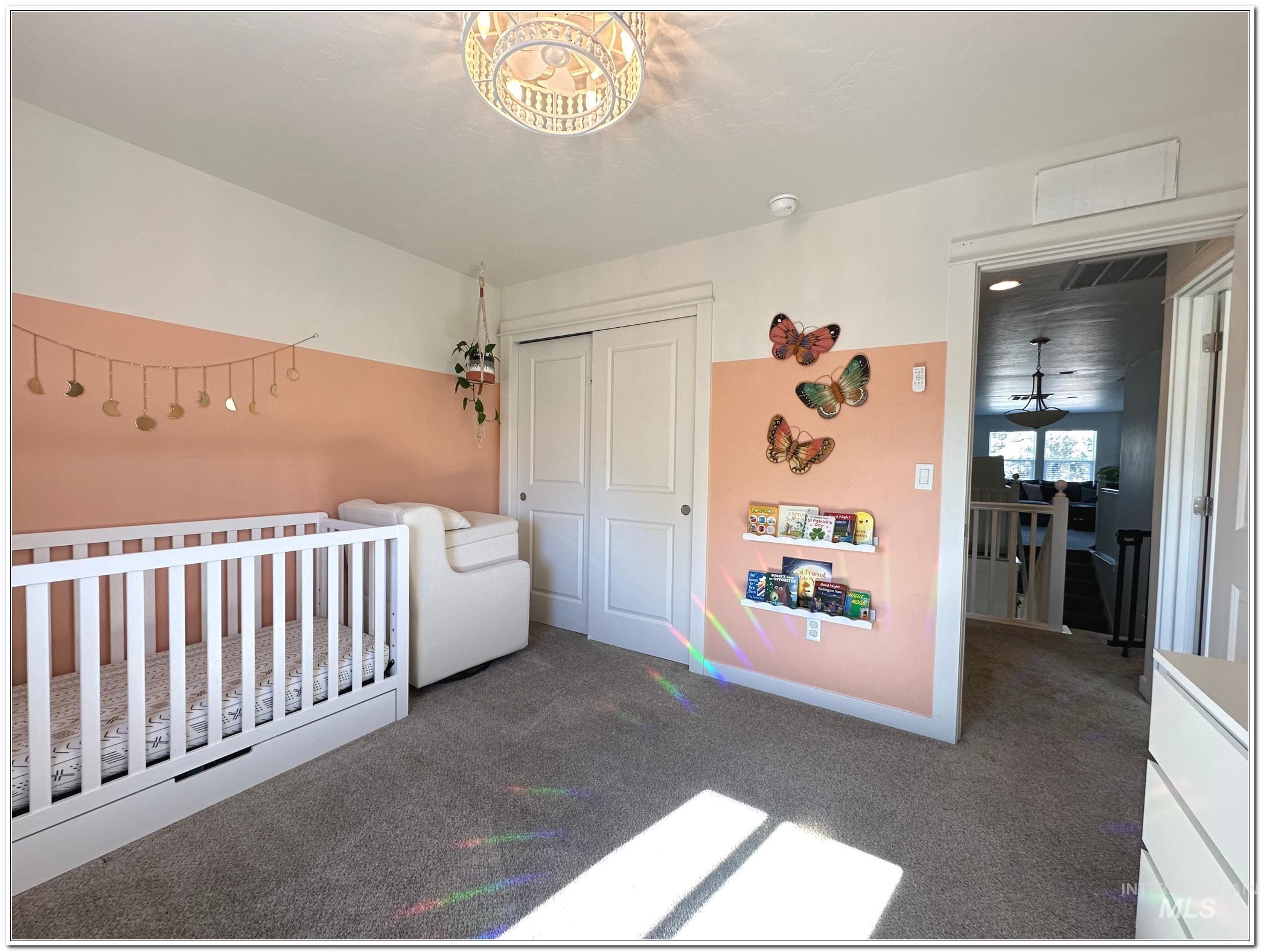 9687 West Arnold Road Boise, ID 83714 - Photo 27 of 49 Carpeted bedroom featuring a nursery area and a closet