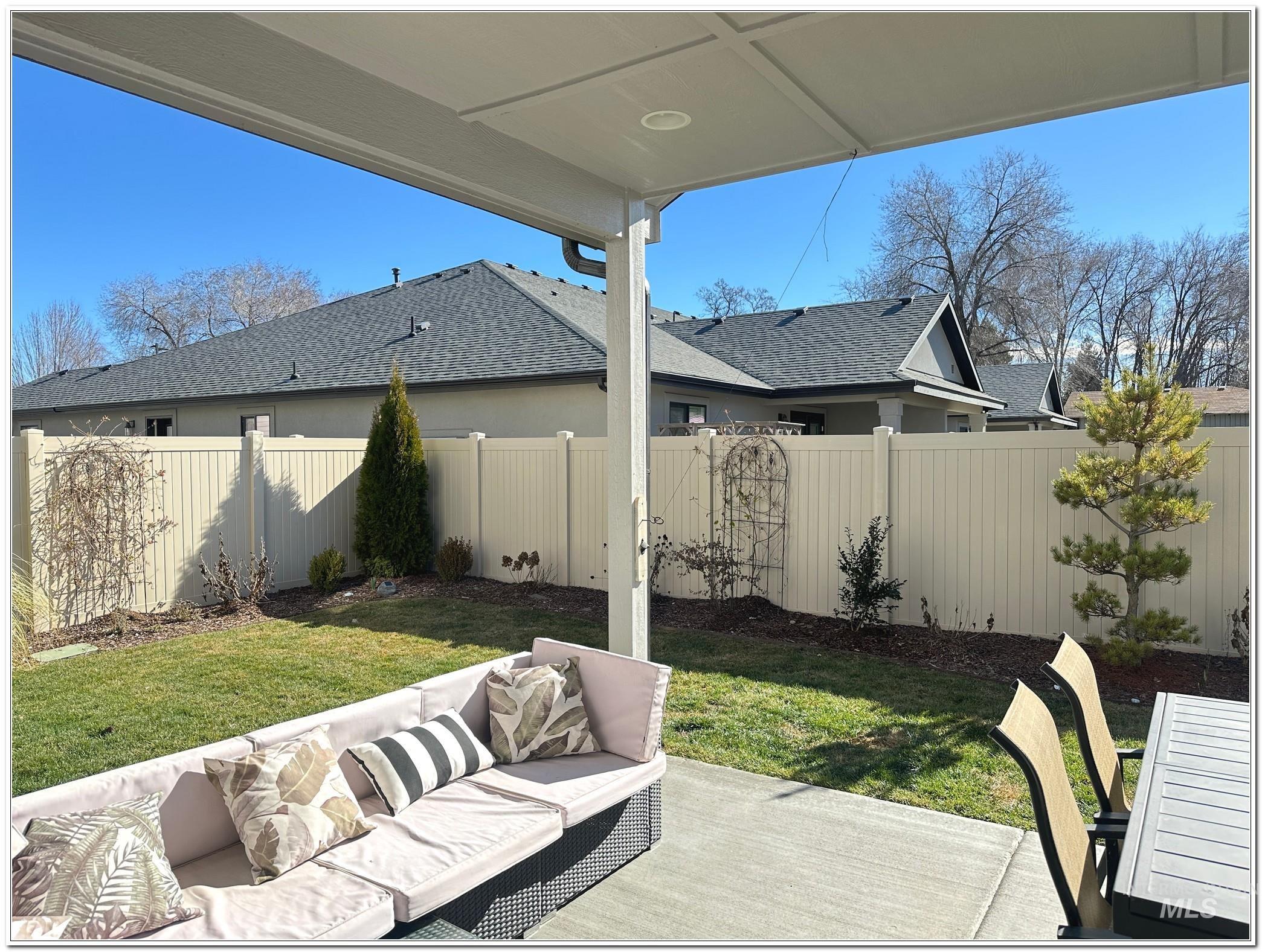 9687 West Arnold Road Boise, ID 83714 - Photo 41 of 49 Fenced backyard featuring outdoor seating and a patio area