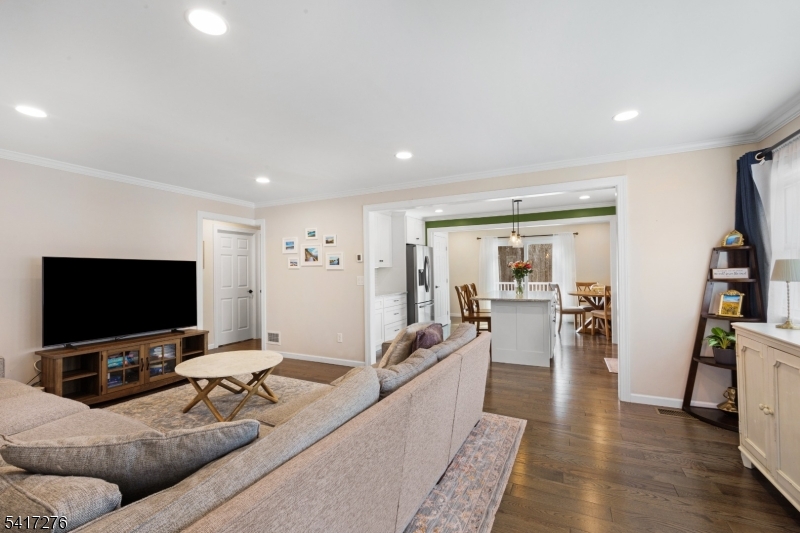 255 Dover Chester Road Randolph, NJ 07869 - Photo 13 of 37 a living room with furniture and a flat screen tv