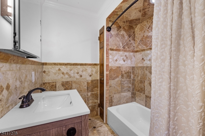 255 Dover Chester Road Randolph, NJ 07869 - Photo 18 of 37 a bathroom with a sink and a shower