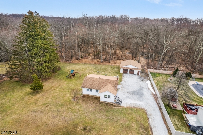 255 Dover Chester Road Randolph, NJ 07869 - Photo 2 of 37 a view of a swimming pool with a patio