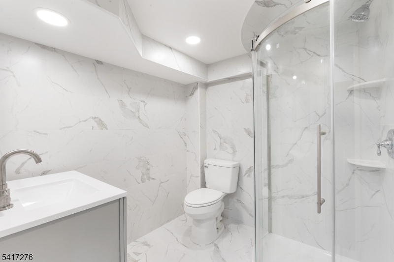 255 Dover Chester Road Randolph, NJ 07869 - Photo 21 of 37 a bathroom with a toilet a sink and shower