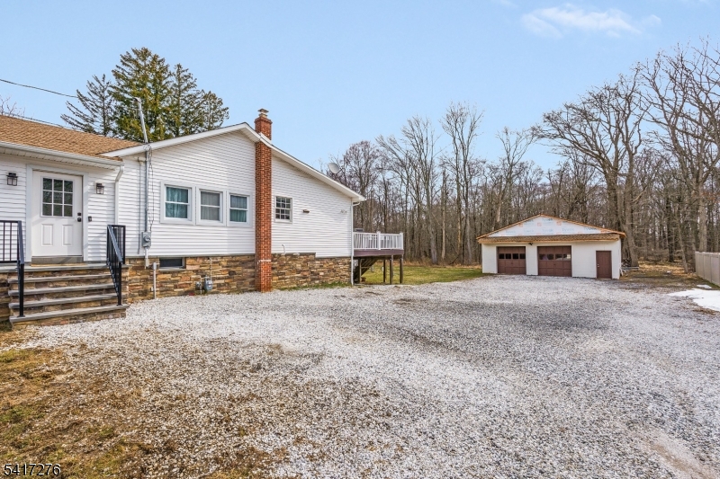 255 Dover Chester Road Randolph, NJ 07869 - Photo 33 of 37 a front view of a house with a yard and garage