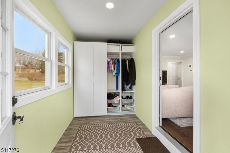 255 Dover Chester Road Randolph, NJ 07869 - Photo 4 of 37 a view of hallway with walk in closet and wooden floor