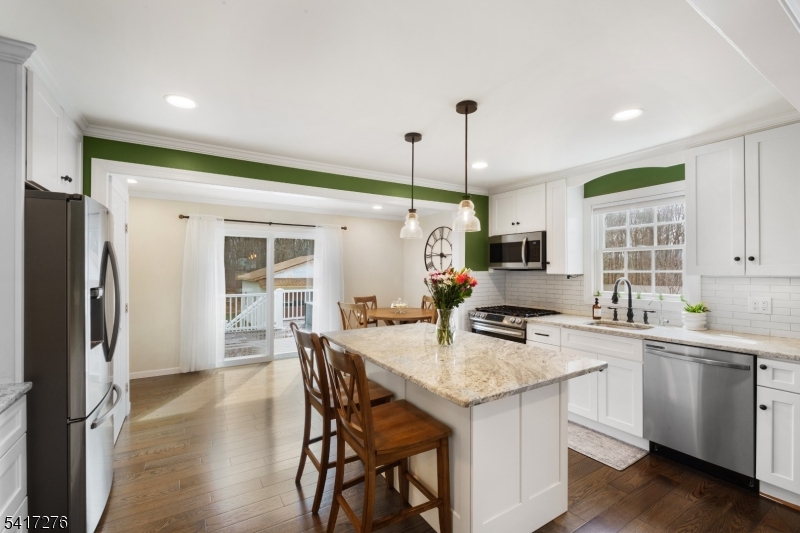 255 Dover Chester Road Randolph, NJ 07869 - Photo 8 of 37 a kitchen with granite countertop a sink stove and refrigerator