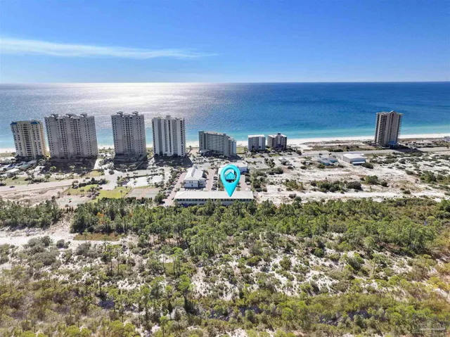 a kitchen with a sink and a wooden floor