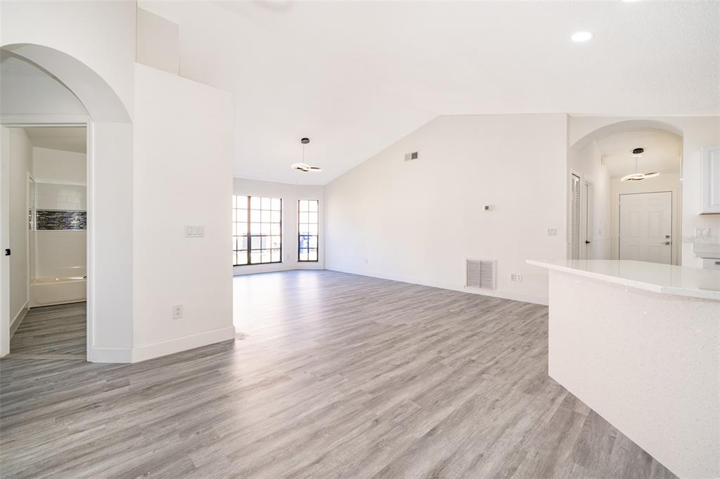 2006 Key Lime Street Ocoee, FL 34761 - Photo 12 of 28 wooden floor in an empty room with a window