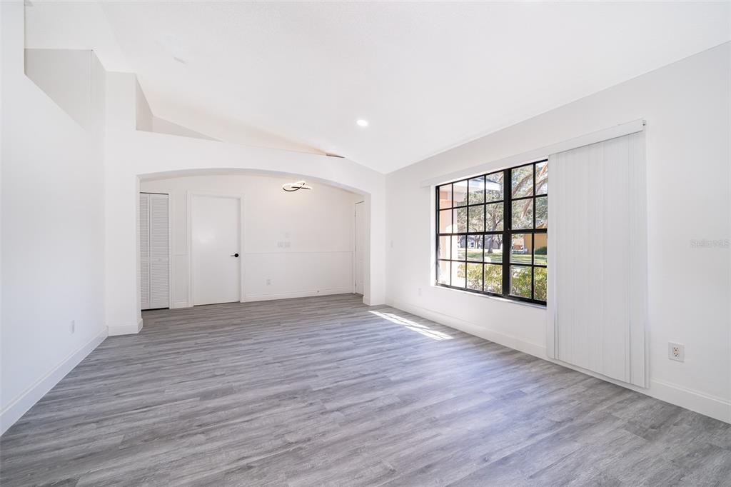 2006 Key Lime Street Ocoee, FL 34761 - Photo 14 of 28 wooden floor in an empty room with a window