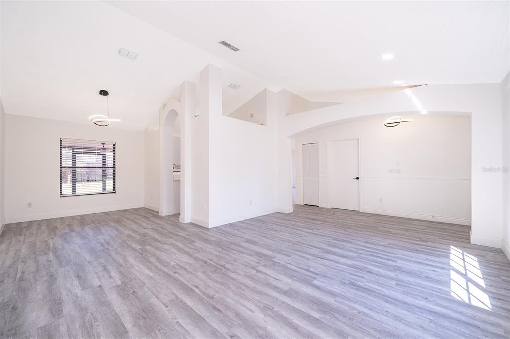 2006 Key Lime Street Ocoee, FL 34761 - Photo 15 of 28 an empty room with wooden floor and windows