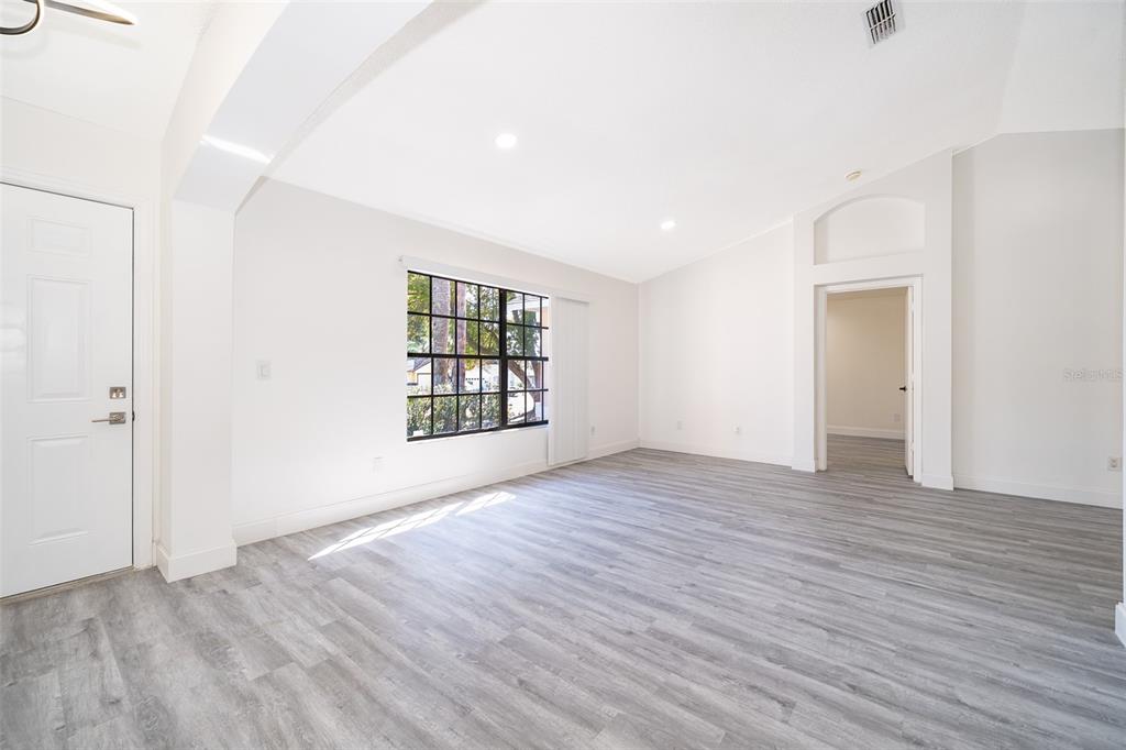 2006 Key Lime Street Ocoee, FL 34761 - Photo 16 of 28 an empty room with wooden floor and windows