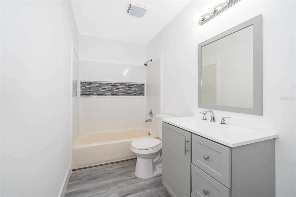 2006 Key Lime Street Ocoee, FL 34761 - Photo 20 of 28 a bathroom with a sink a toilet and shower