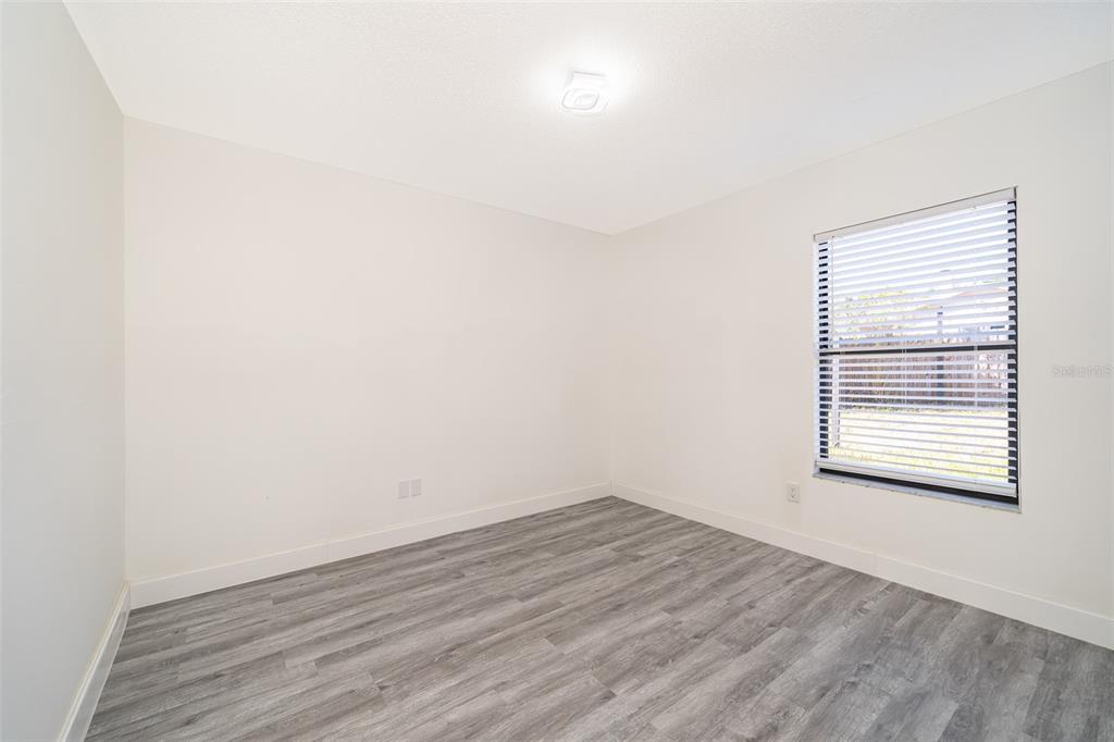 2006 Key Lime Street Ocoee, FL 34761 - Photo 23 of 28 a view of a room that has wooden floor and a window