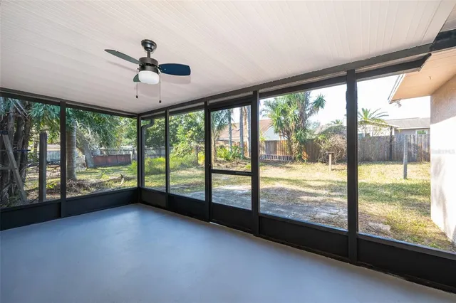 a view of an empty room with a large window