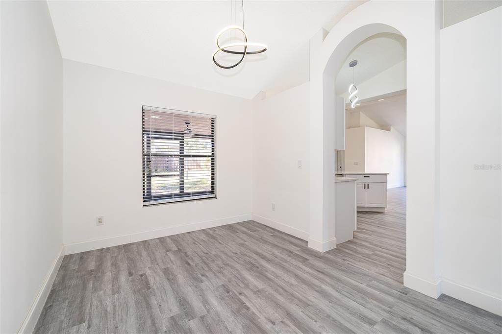 2006 Key Lime Street Ocoee, FL 34761 - Photo 5 of 28 a view of empty room with wooden floor and fan