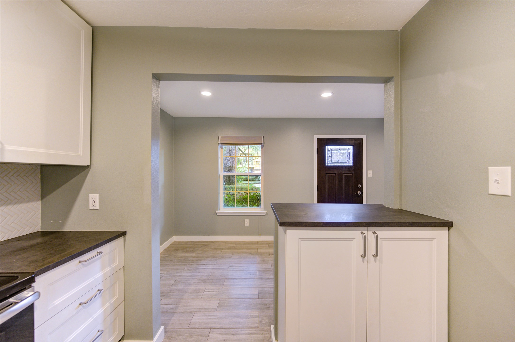 3224 Timmons Lane, Unit 155 Houston, TX 77027 - Photo 14 of 50 a kitchen with granite countertop cabinets stainless steel appliances and a counter space
