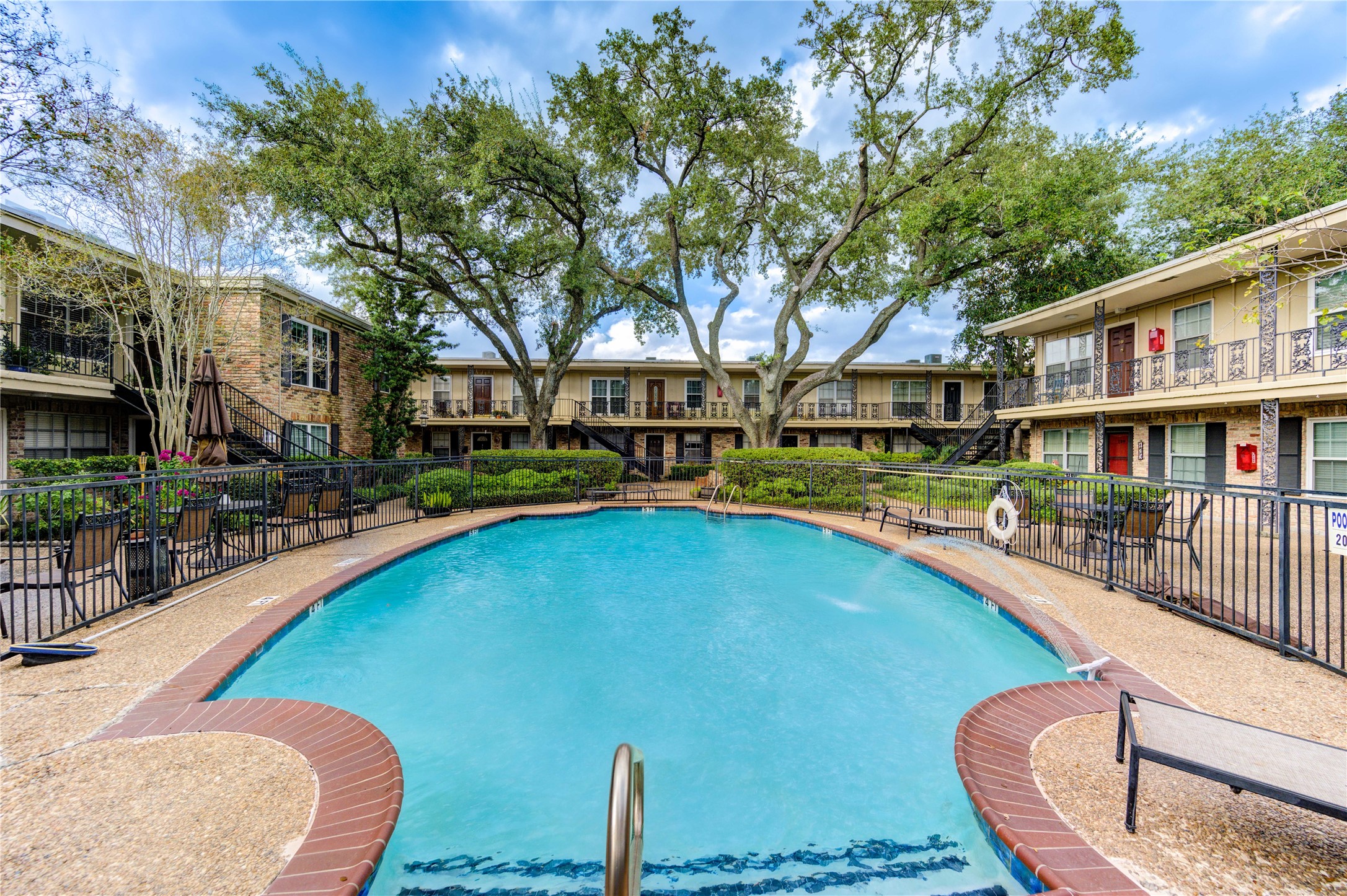 3224 Timmons Lane, Unit 155 Houston, TX 77027 - Photo 41 of 50 a swimming pool with outdoor seating and yard