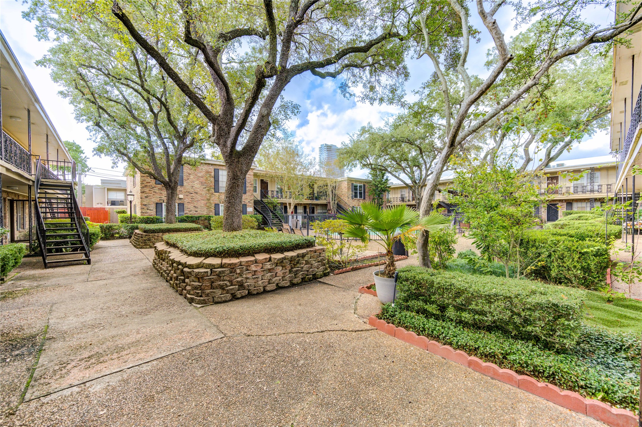 3224 Timmons Lane, Unit 155 Houston, TX 77027 - Photo 45 of 50 a front view of a house with a yard