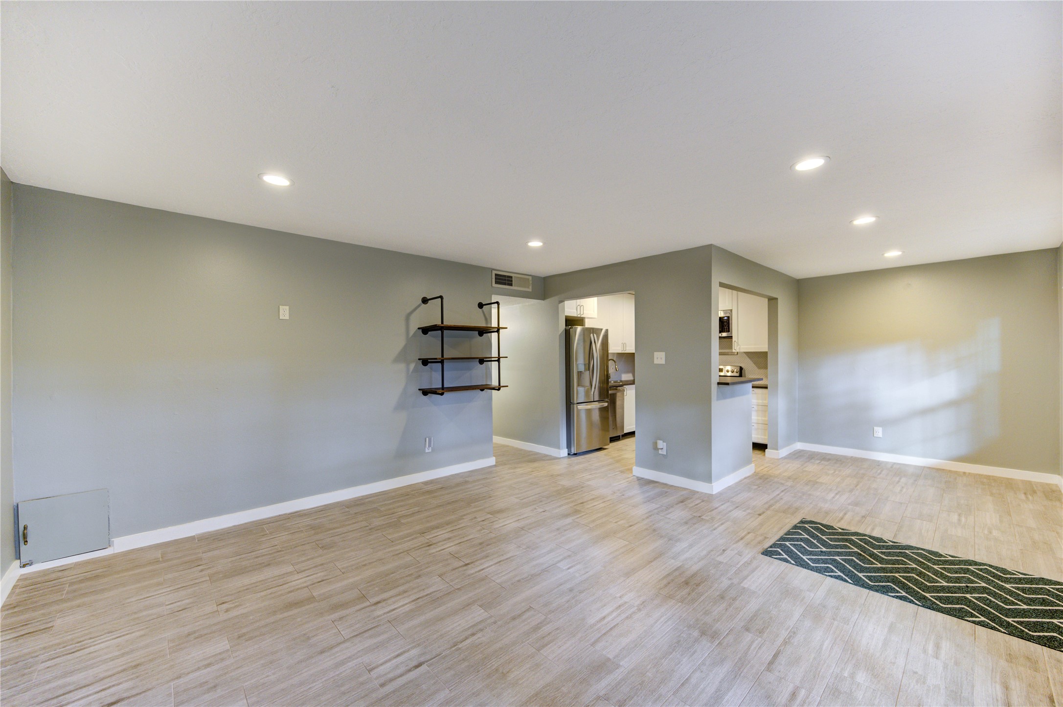 3224 Timmons Lane, Unit 155 Houston, TX 77027 - Photo 9 of 50 a view of empty room with wooden floor
