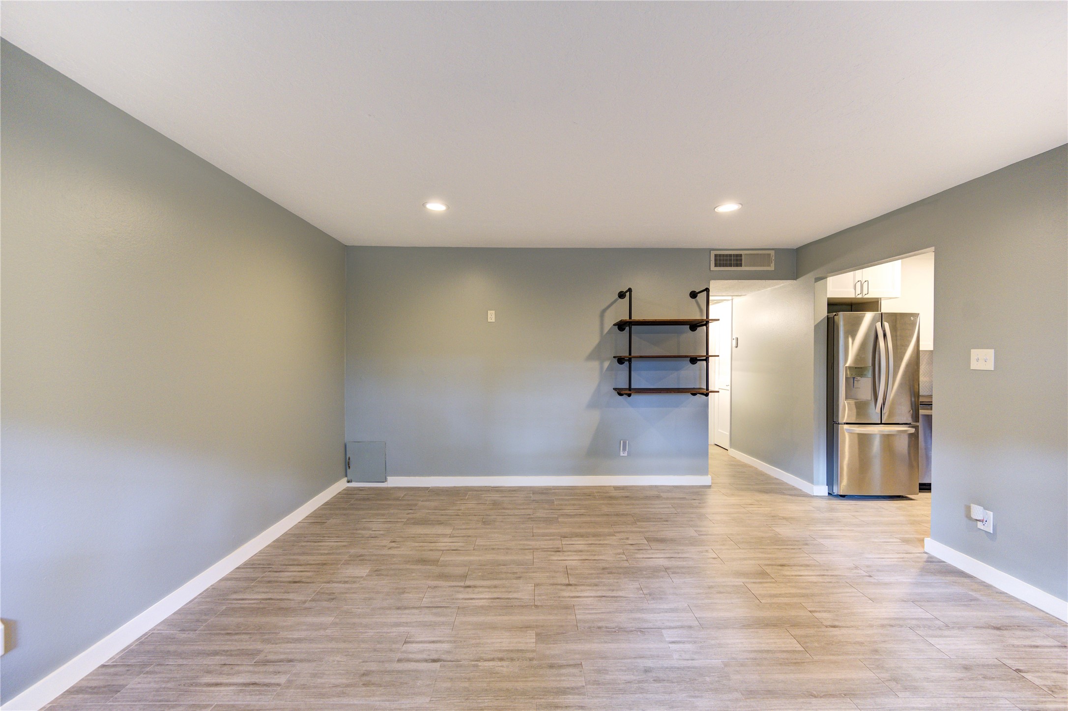 3224 Timmons Lane, Unit 155 Houston, TX 77027 - Photo 10 of 50 a view of empty room with wooden floor