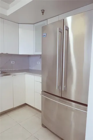 an empty room with sliding glass door