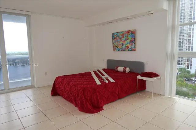 a bathroom with a bath tub with a shower