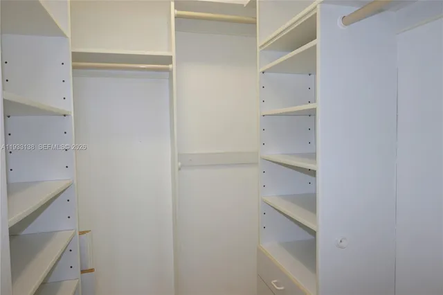 a view of a closet area in a room