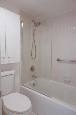 a bathroom with a sink and a washer