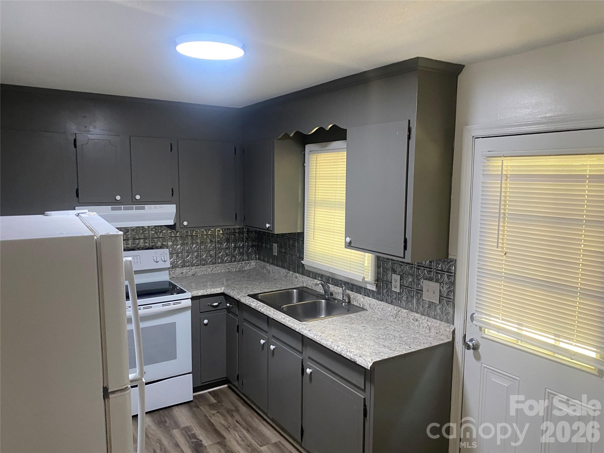 788 Coley Road Salisbury, NC 28146 - Photo 34 of 43 a kitchen with a sink stove and cabinets