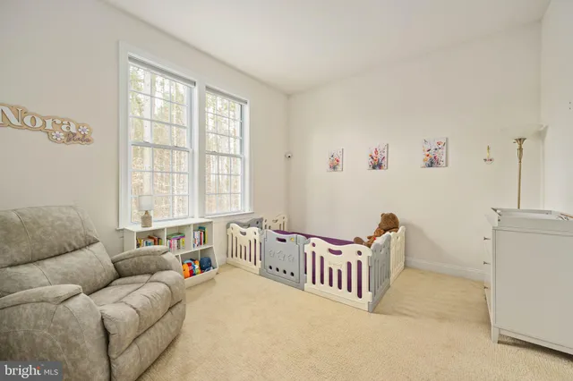 a spacious bathroom with a granite countertop sink and a large mirror