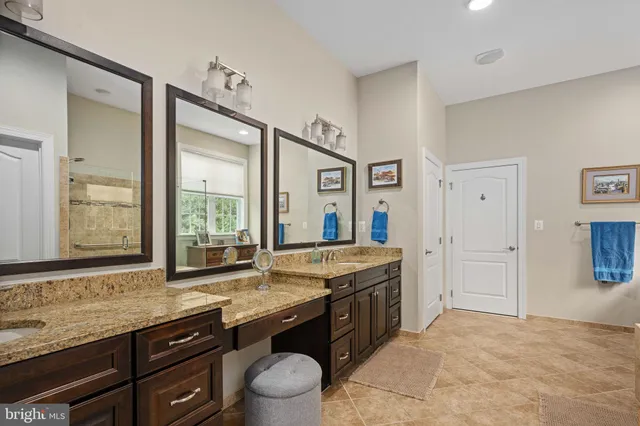 a view of a lake with a table and chairs
