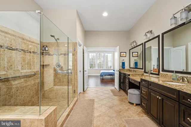 an aerial view of a house with swimming pool lake view and mountain view