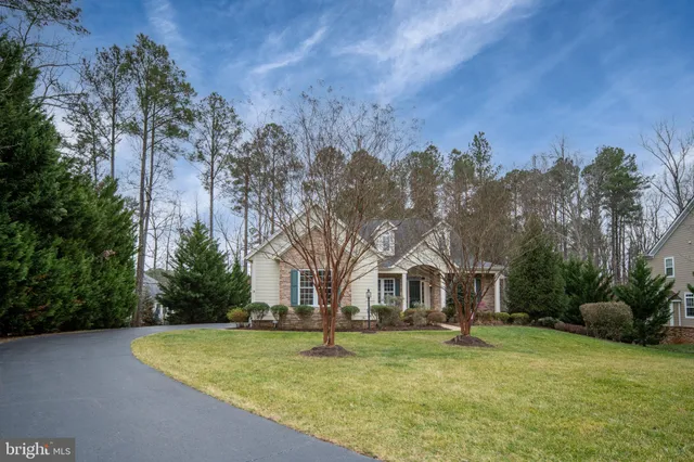 a view of a house with a yard and plants