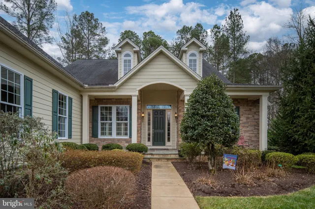 a front view of a house with a small porch
