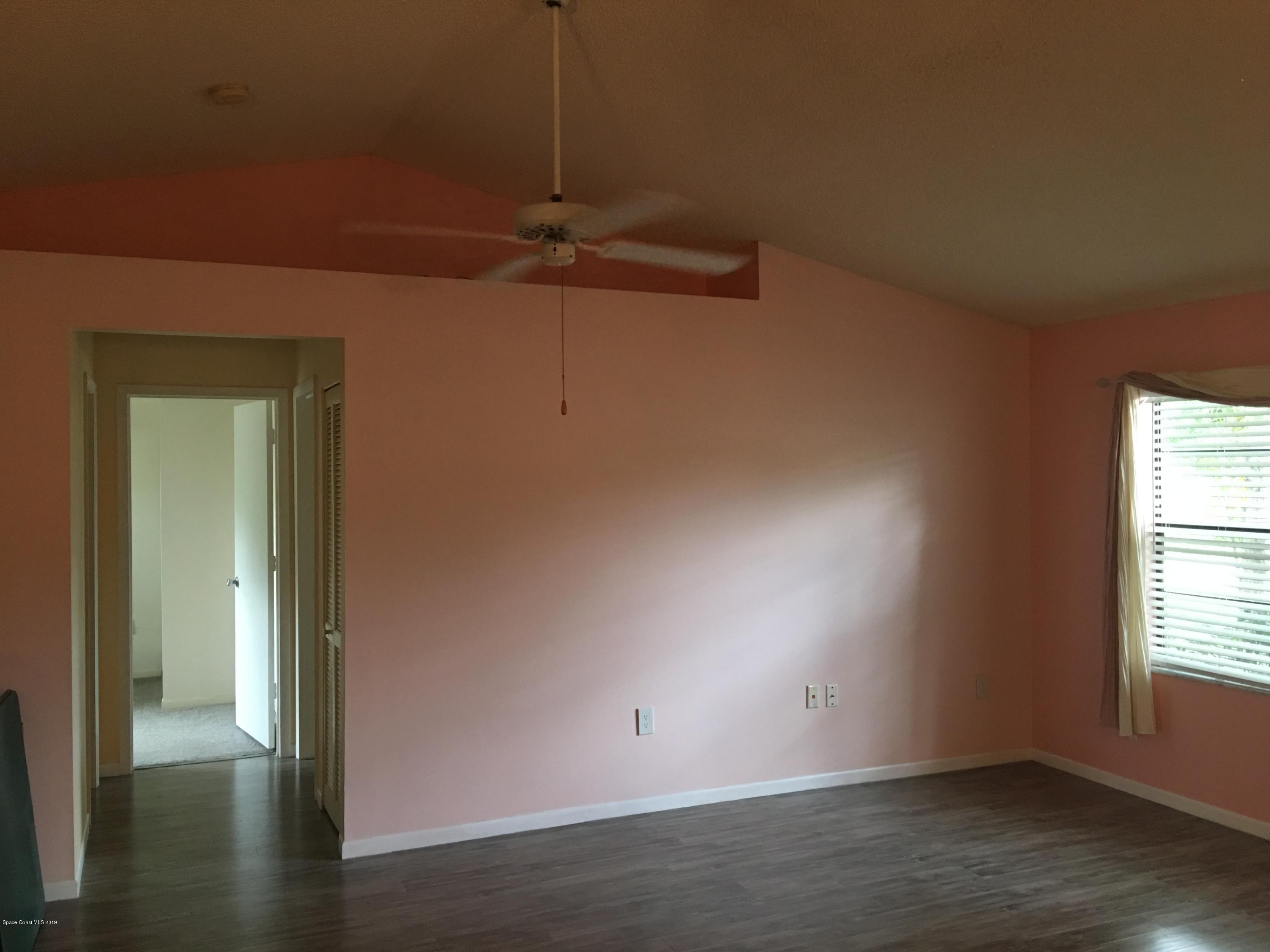 170 Santa Rosa Avenue Southwest Palm Bay, FL 32908 - Photo 6 of 32 Living room looking to hallway