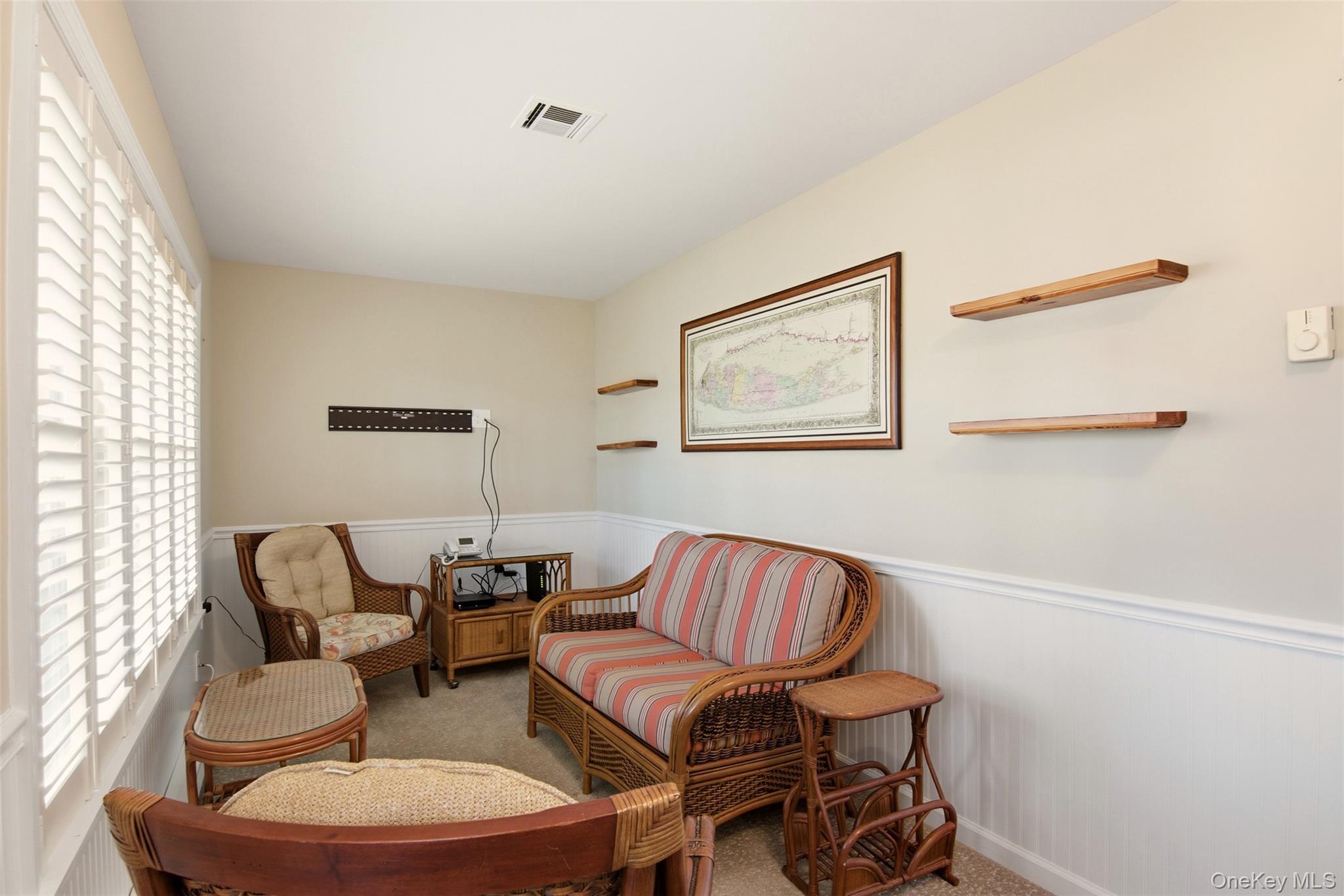 360 Woodbridge Drive, Unit A Ridge, NY 11961 - Photo 14 of 34 a living room with furniture and a large window
