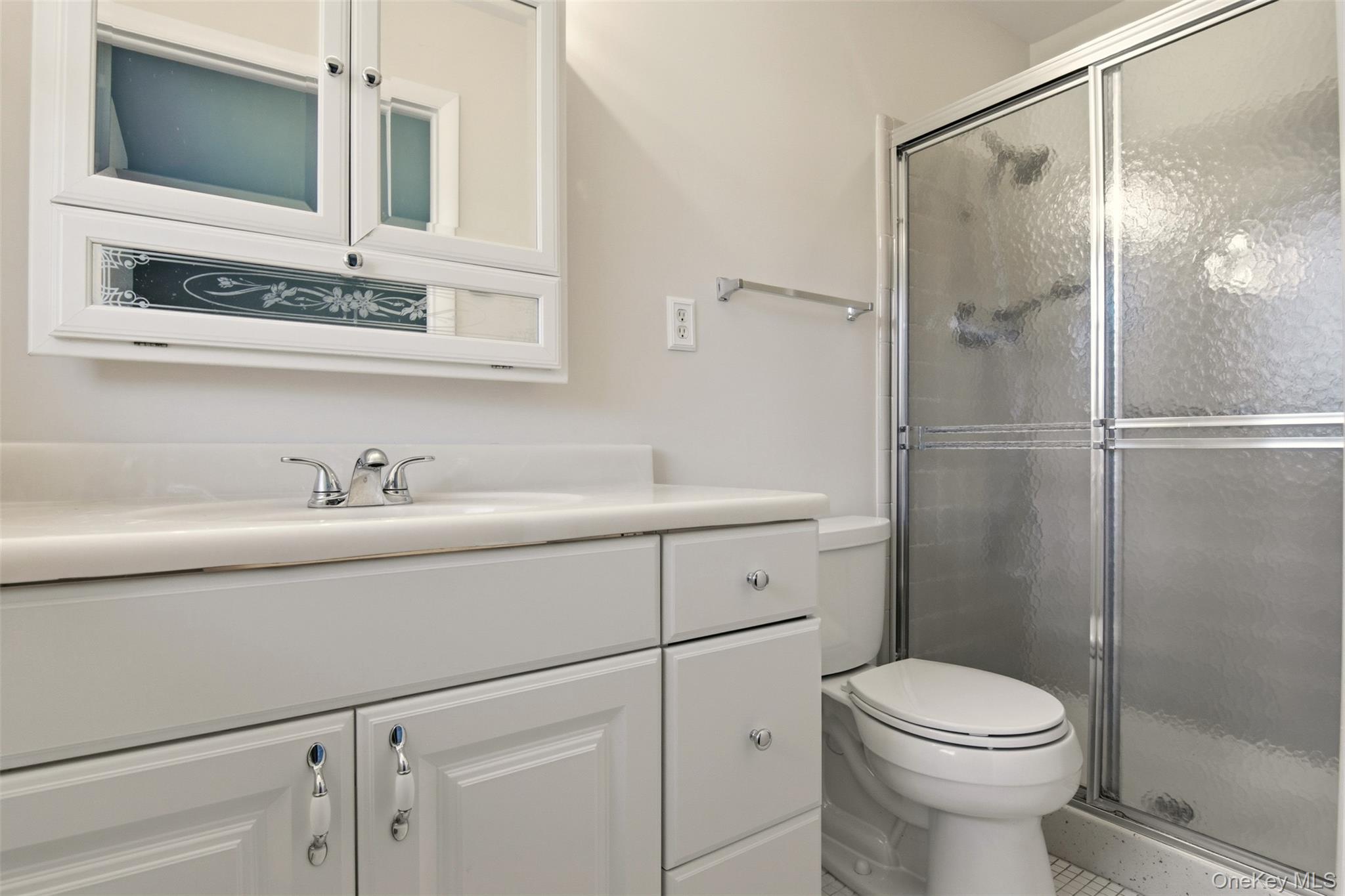360 Woodbridge Drive, Unit A Ridge, NY 11961 - Photo 18 of 34 a bathroom with a sink a toilet and shower