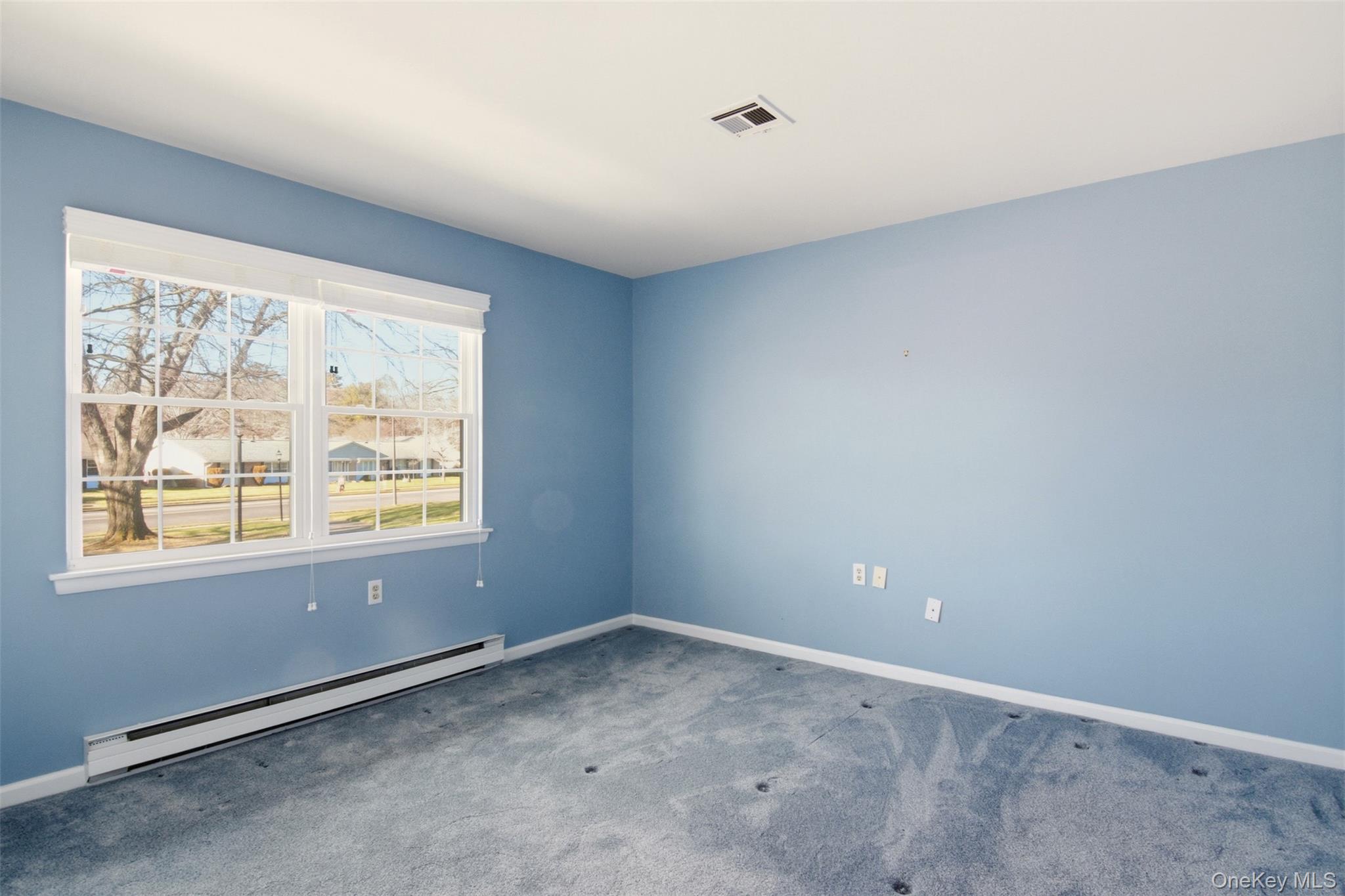 360 Woodbridge Drive, Unit A Ridge, NY 11961 - Photo 19 of 34 an empty room with a window