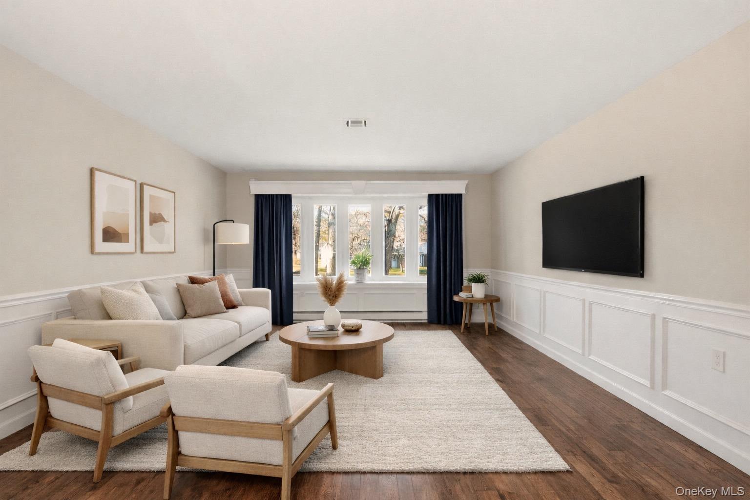 360 Woodbridge Drive, Unit A Ridge, NY 11961 - Photo 2 of 34 a living room with furniture and a flat screen tv