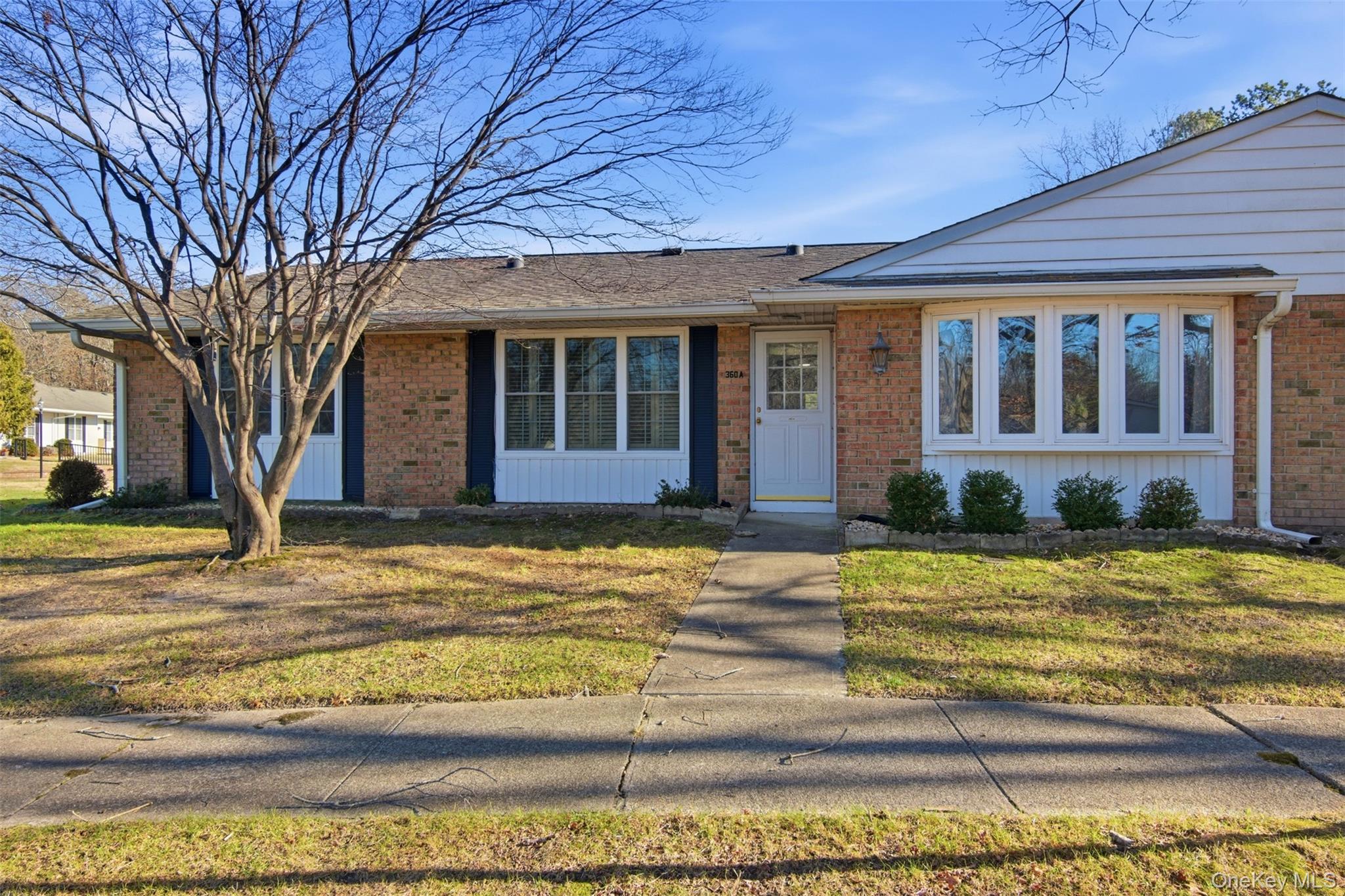 360 Woodbridge Drive, Unit A Ridge, NY 11961 - Photo 22 of 34 a view of a house with a swimming pool
