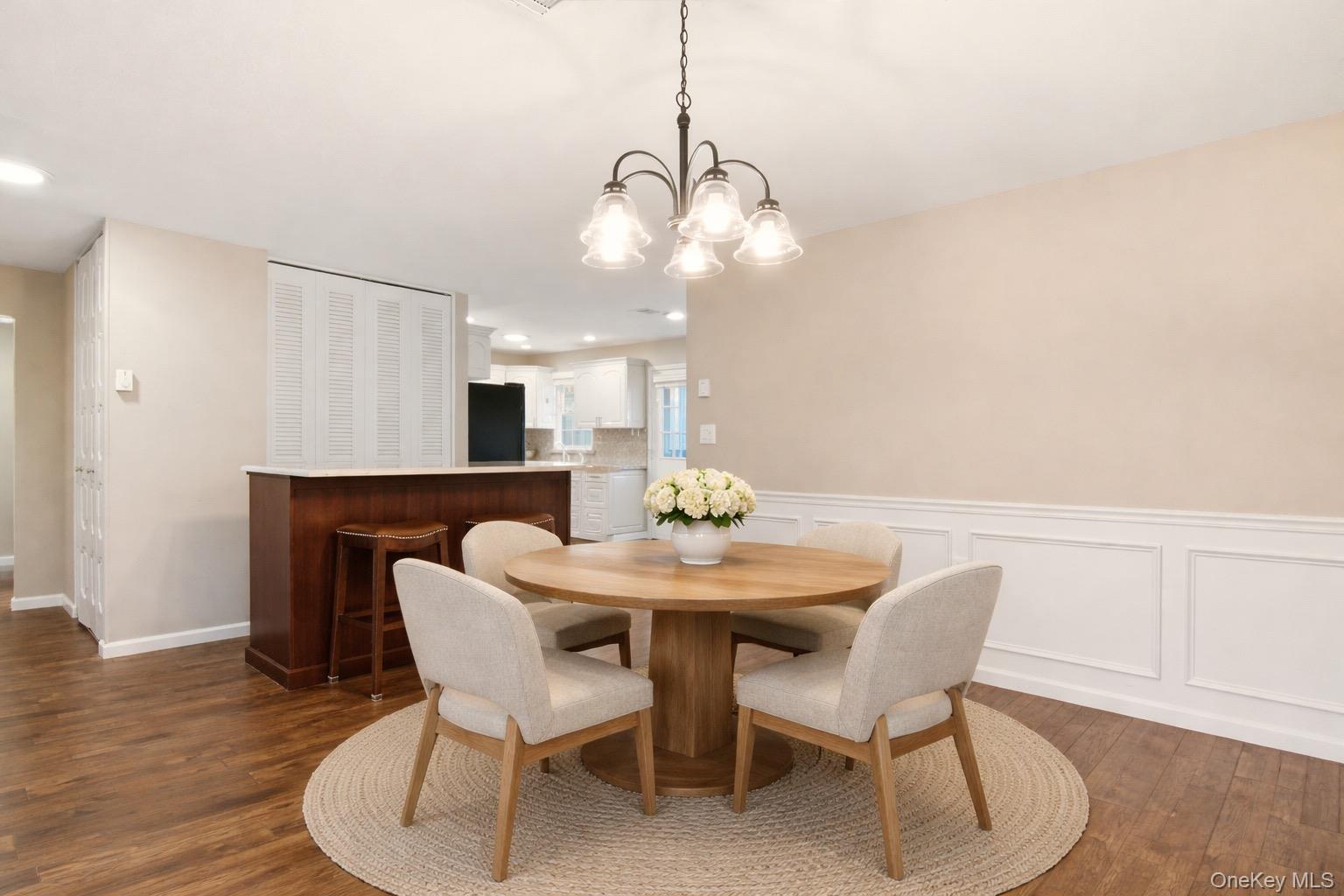 360 Woodbridge Drive, Unit A Ridge, NY 11961 - Photo 5 of 34 a dining room with furniture and wooden floor