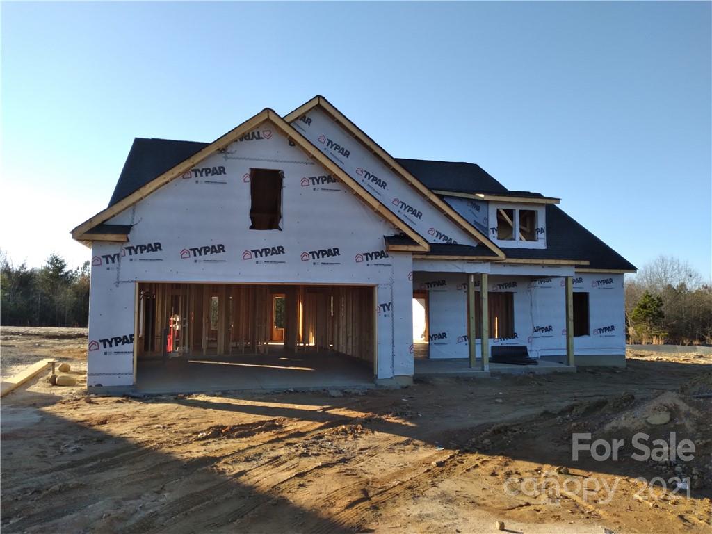 2173 State Rd S-46-1474, Unit 10 Clover, SC 29710 - Photo 3 of 10 a front view of a house with garden
