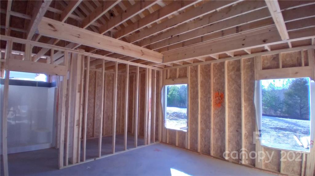 2173 State Rd S-46-1474, Unit 10 Clover, SC 29710 - Photo 6 of 10 a view of an empty room with wooden floor and windows